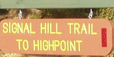 Trailhead sign from the Magazine Mountain Lodge site